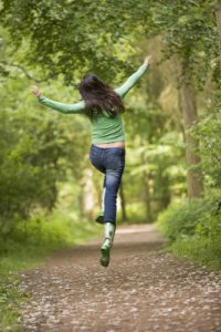 Woman jumping on path